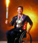 Mike Schlappi holding Paralympic Torch